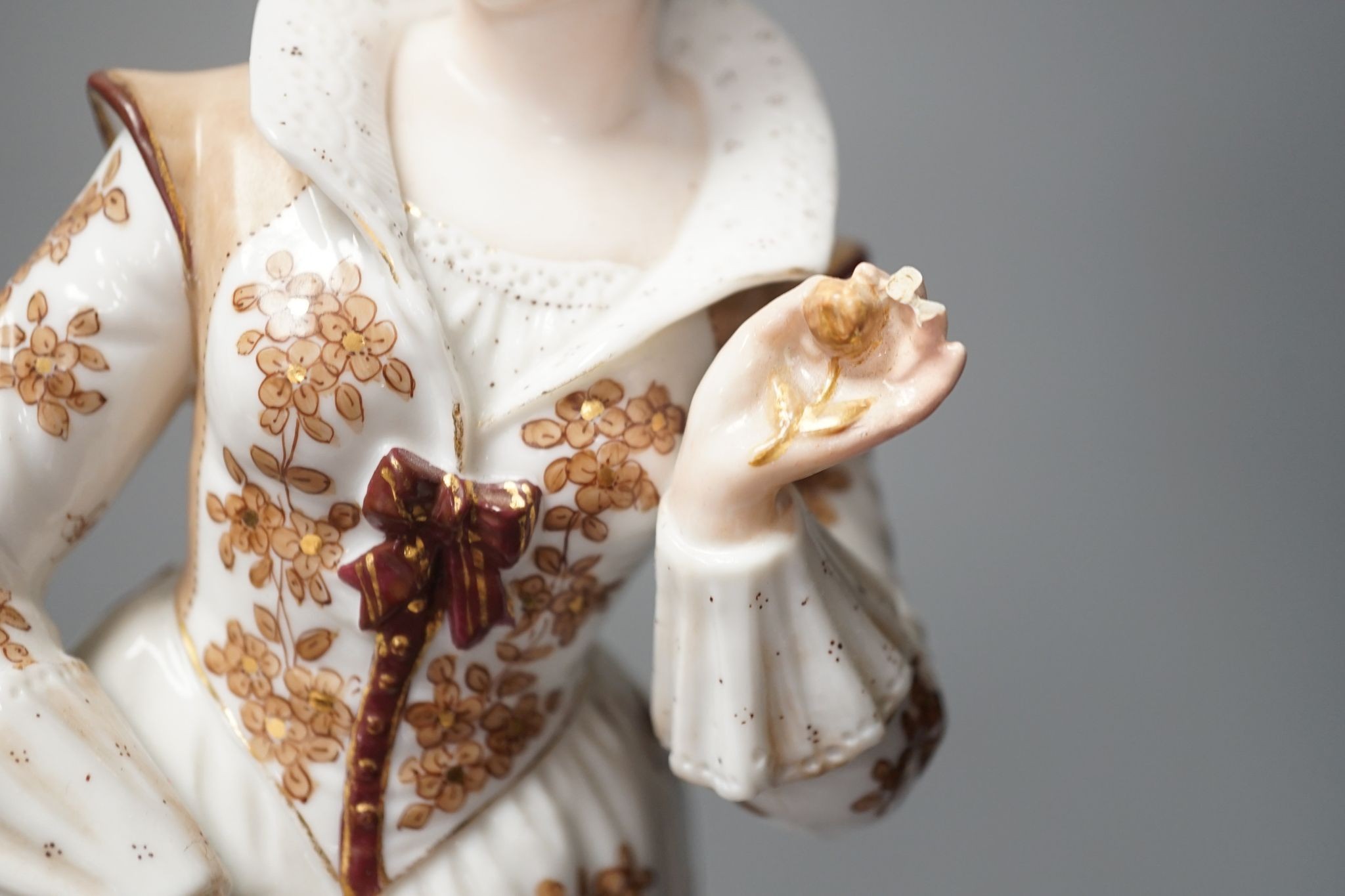 A pair of large French porcelain figures, 38cm, and a figural group en suite